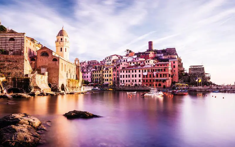 Vernazza village and harbour in the Cinque Terre, Italy at sunset, long exposure so some movement in the boats.