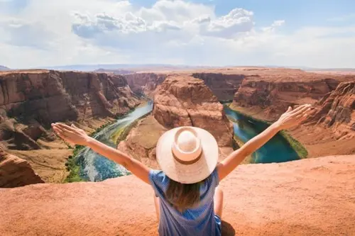 Woman in front on the Arizona canyon in the summer